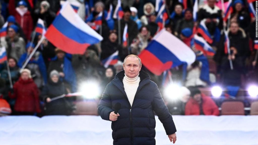 Vladimir Putin celebrates the annexation of Crimea with a crowd as Russia continues its assault on Ukraine