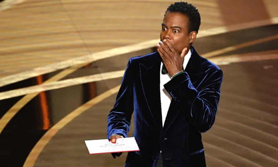 You know what a woman is like!  Chris Rock performs at the Oscars.