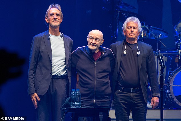 A warm welcome: Phil Collins paid an emotional farewell to Genesis fans alongside bandmates Mike Rutherford (left) and Tony Banks (right) in London on Saturday - where the famous band held their last-ever concert.