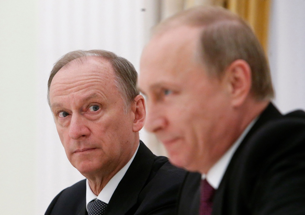 Russian Security Council Secretary Nikolai Patrushev (L) looks at President Vladimir Putin during a meeting with top BRICS officials responsible for security affairs at the Kremlin in Moscow on May 26, 2015.