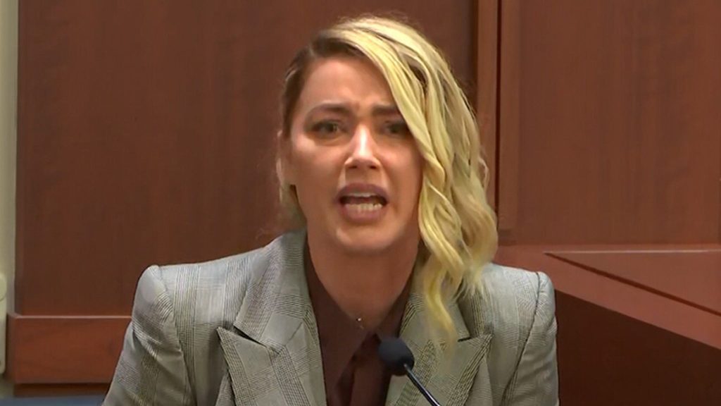 Amber Heard cries on guard, says she receives death threats during Depp's trial