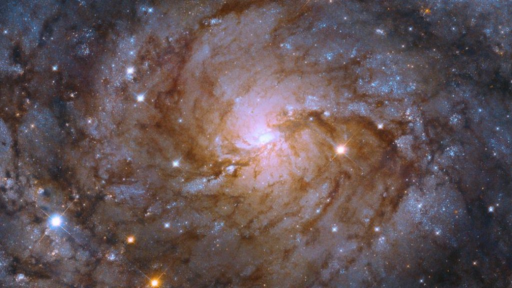 The Hubble Telescope Observes the "Hidden Galaxy" Behind the Milky Way