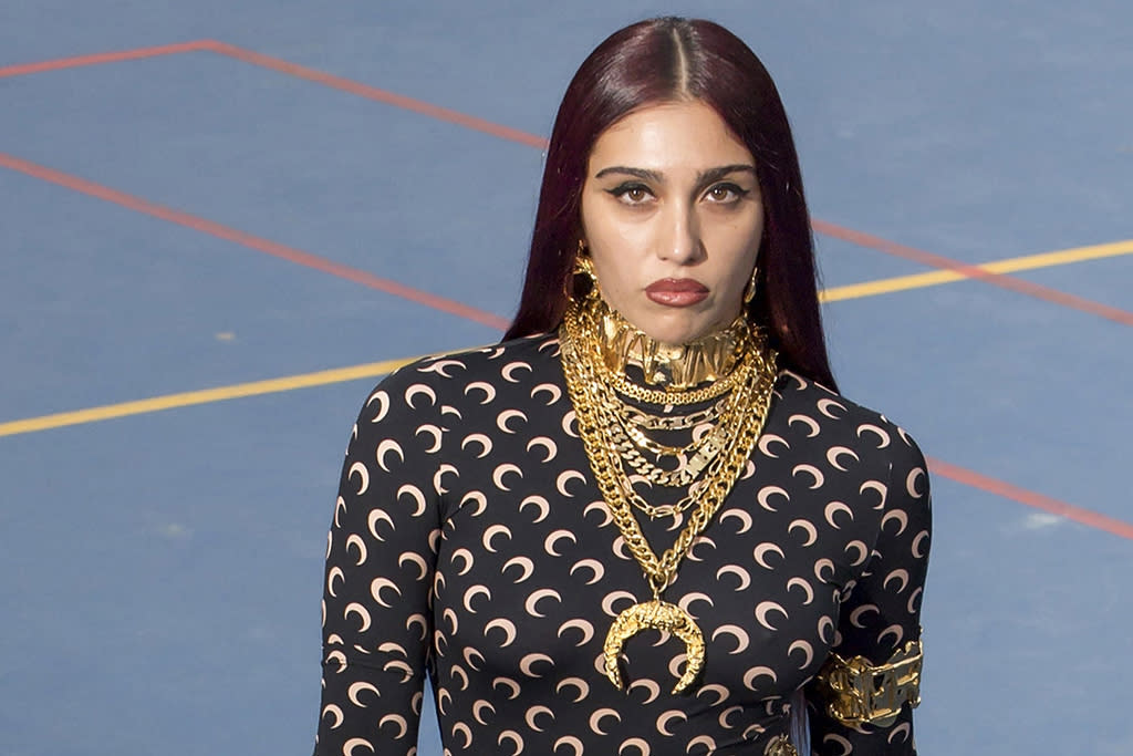 Lord Lyon, Madonna's daughter, wears gold chains on the runway at the Marine Seri runway show