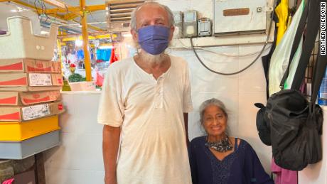 Chicken seller Muhammed Gillihar and his wife in their shop in Singapore.