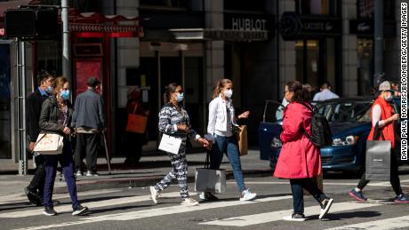 Pedestrians carry shopping bags in San Francisco, California, on Wednesday, June 1, 2022. US consumer confidence has dropped to an all-time low, according to preliminary data released Friday from the University of Michigan. 