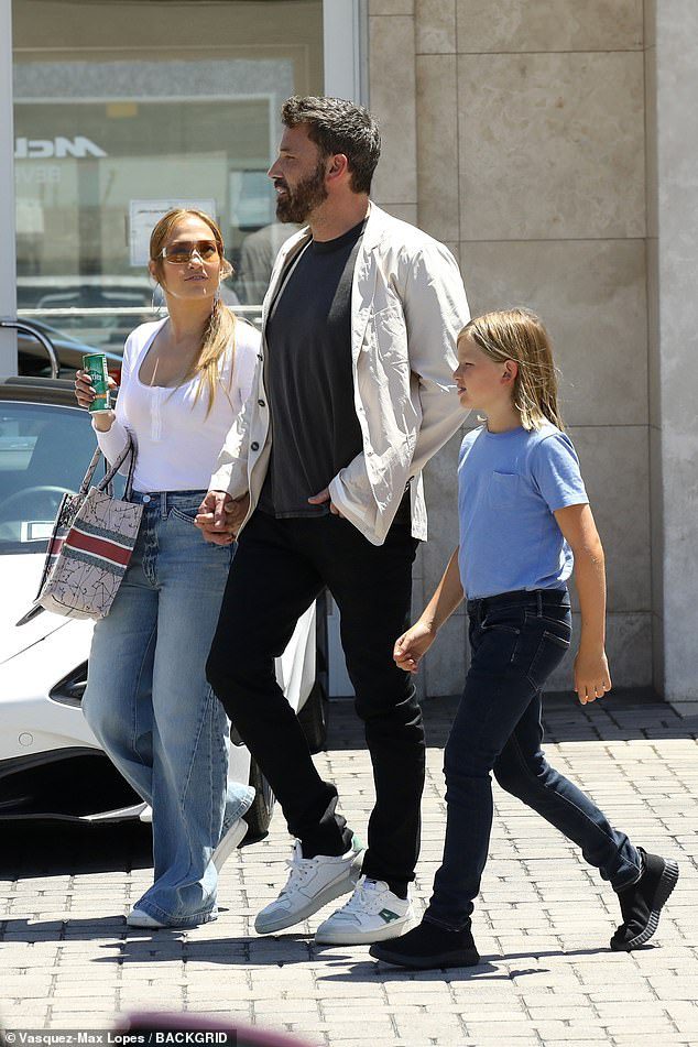 Going out with son: The couple looked at a number of high-end cars alongside Affleck's 10-year-old son Samuel