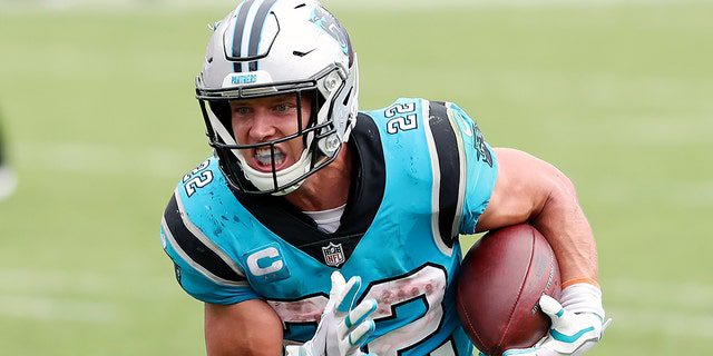 Carolina Panthers dribble back Christian McCaffrey rushes to land in front of the Tampa Bay Pirates during a game on September 20, 2020, in Tampa, Florida.