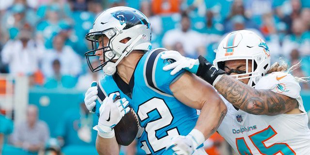 Christian McCaffrey (22) of the Carolina Panthers during a game against the Miami Dolphins at Hard Rock Stadium on November 28, 2021, in Miami Gardens, Florida.