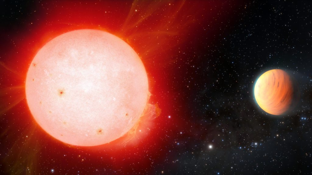 A giant fluffy planet orbiting a cool red dwarf star