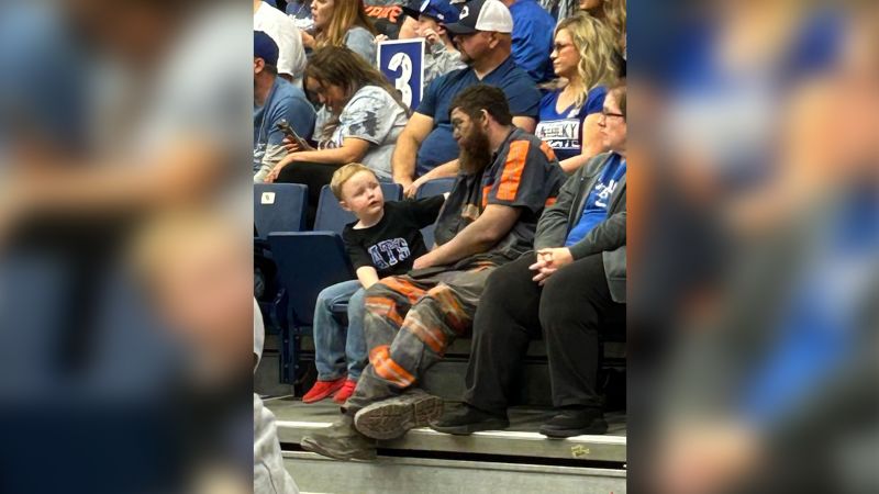Kentucky Wildcats coach John Calipari shares a photo of a coal miner rushing from work to attend his son's first game—and invites the family to Lexington for a game.