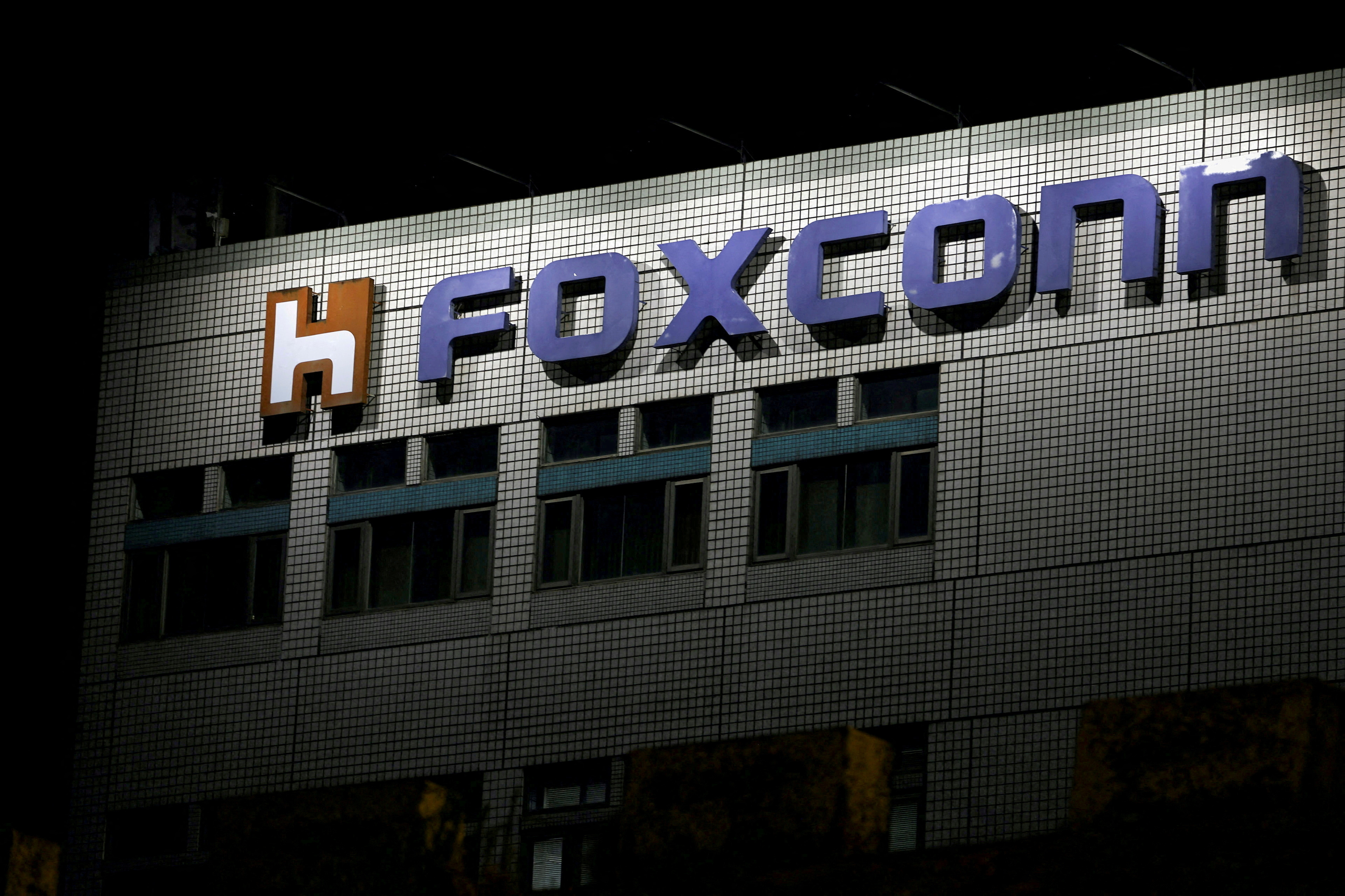 The Foxconn logo appears outside a company building in Taipei