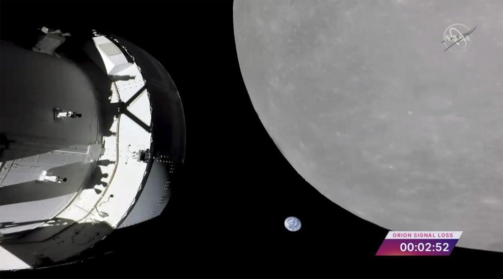 A NASA capsule flies over the moon, the last big step before lunar orbit