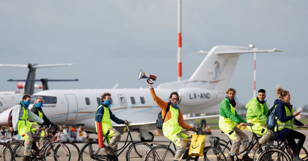 Climate activists block private planes at Amsterdam's Schiphol Airport